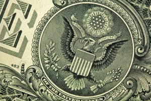 close up shot of the seal of the US government on a dollar
