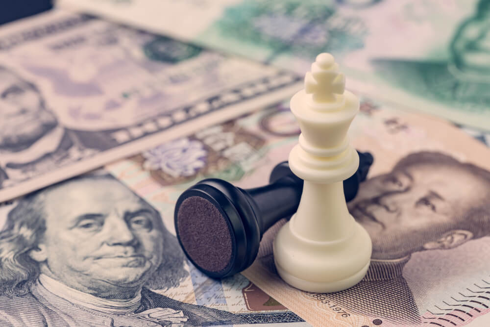 Wibest Broker-Oil Inventory Report: trade war concept, black and white chess pieces with black piece toppled on top of dollar and yuan bills 
