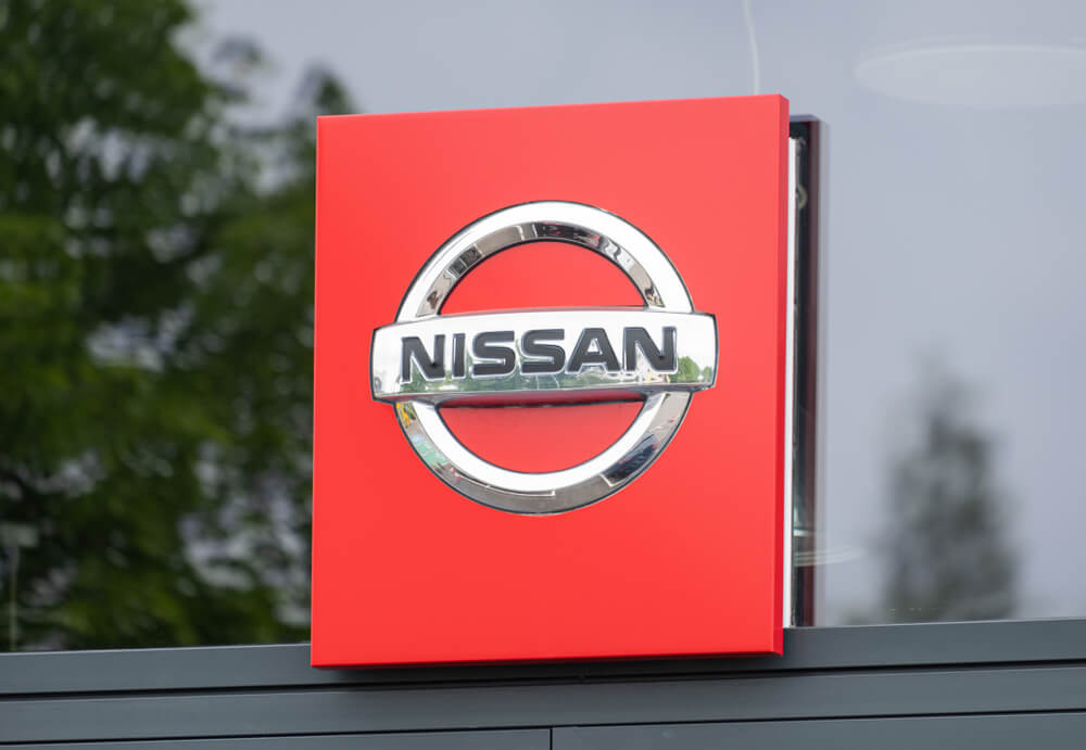Wibest Broker — Carmaker: Nissan sign and logo.