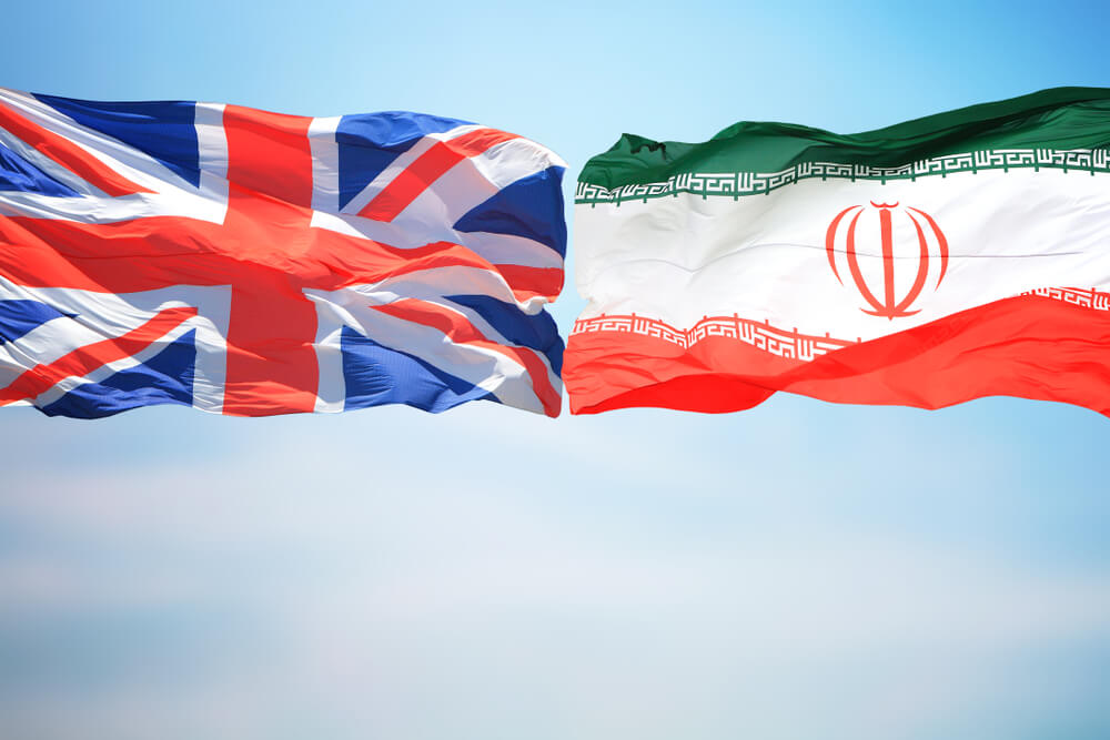 Wibest – Petroleum: The flags of the United Kingdom and Iran against the blue sky