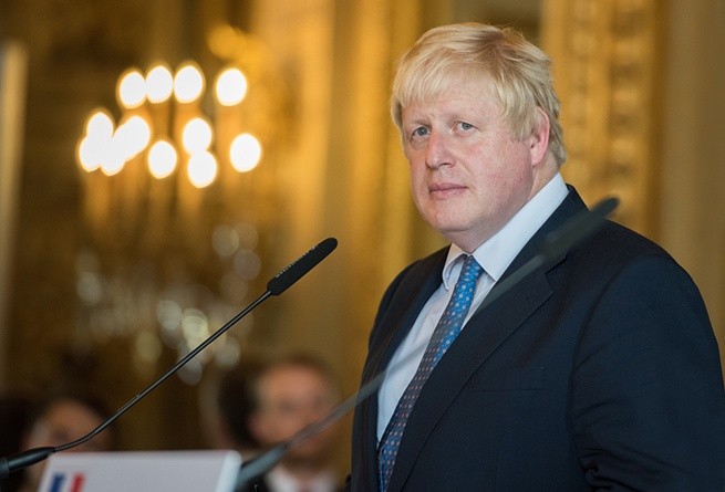 Wibest – Brexit: British Prime Minister Boris Johnson standing in front of a podium.