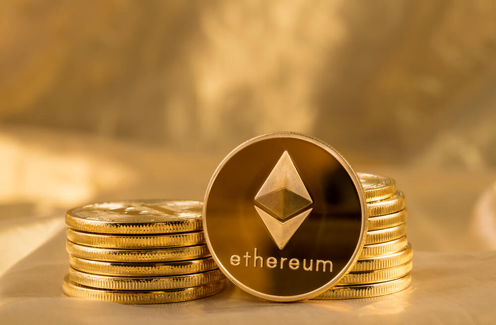Stack of ethereum on gold background.