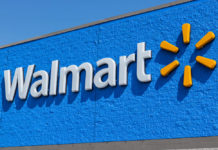 Digital Coins: Walmart logo in white color with sun on the side and blue background.