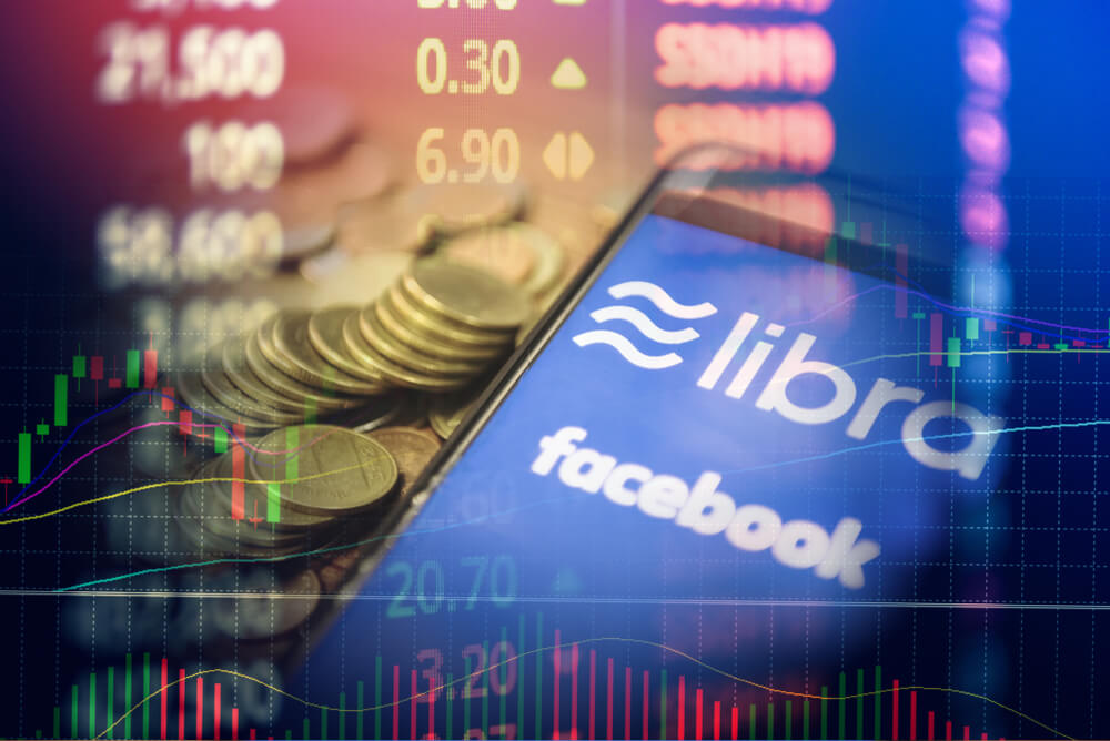 Wibest – Fb: Persons handling phones discussing further goals regarding the digital coin.