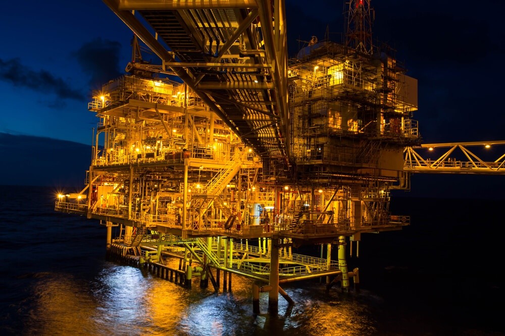 Petroleum Products: Offshore the night Industry oil and gas production petroleum pipeline.