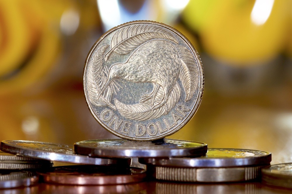 Wibest – NZD USD: A close up of a New Zealand dollar coin.