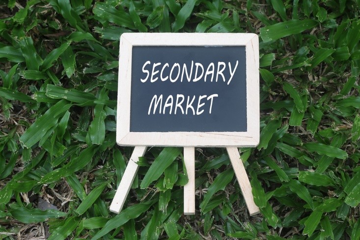 secondary market written on mini chalkboard - wibestbroker