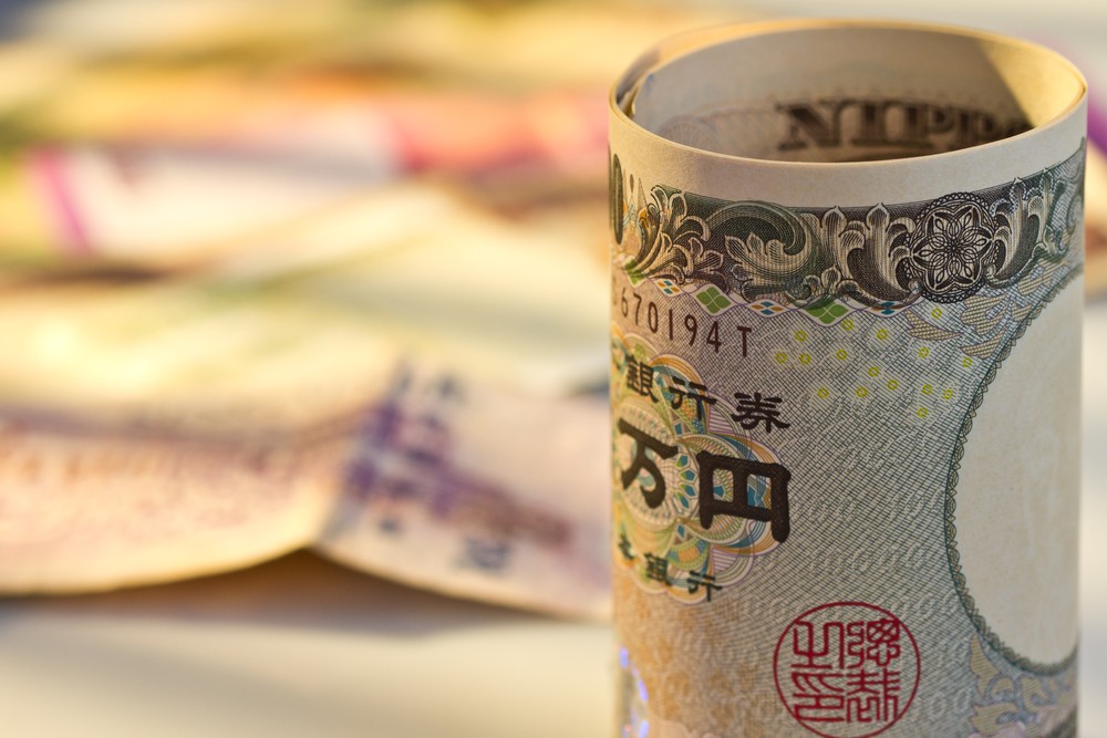 Wibest – Japan Yen: A Japanese yen bill rolled up.