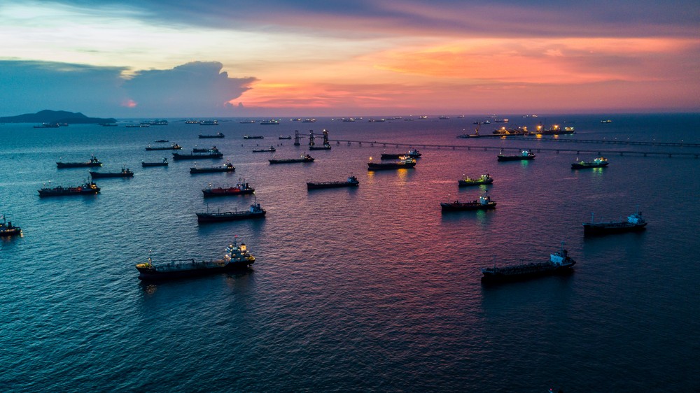 Wibest – Petroleum and Oil: A fleet of oil tanker ships in the middle of the sea.