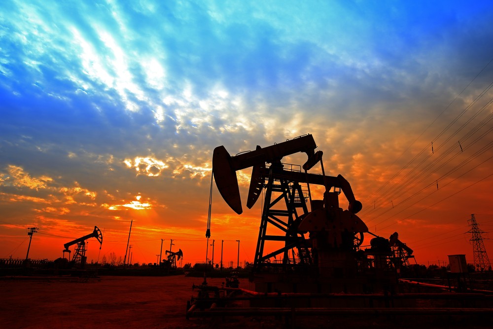 Wibest – Oil Prices: Oil pump-jack over the sunset.