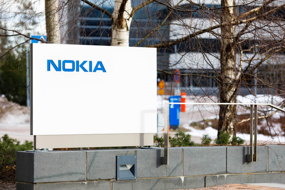 Nokia: Nokia company name on white board next to Nokia head quarter.