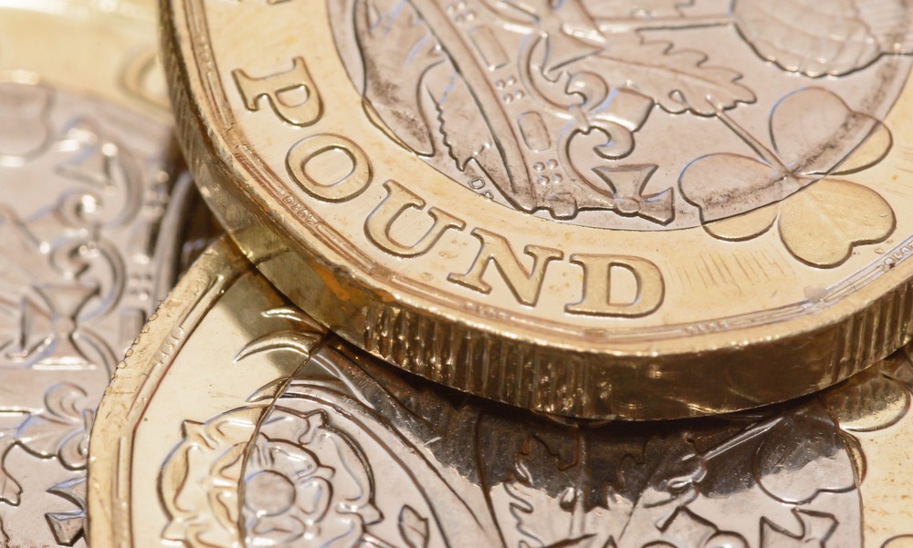 Wibest – USD GBP: A close up of a British pound coin.