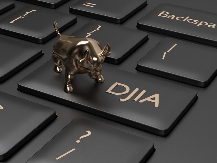 DJIA on keyboard with miniature bull – WibestBroker