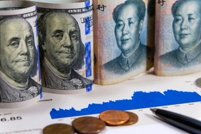 fx market concept, dollar and yuan bills – wibestbroker