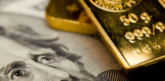Wibest – Spot Gold Price: Gold bars on top or a US dollar bill.