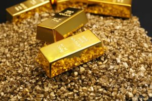 Wibest – Spot Gold Price: Gold bars on top of gold nuggets.