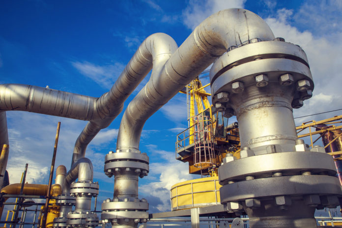 Wibest – Oil and Petroleum: Oil rigs and valves in a refinery.