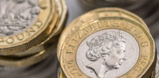 Wibest – Pound Money: British pound coins stacked up.