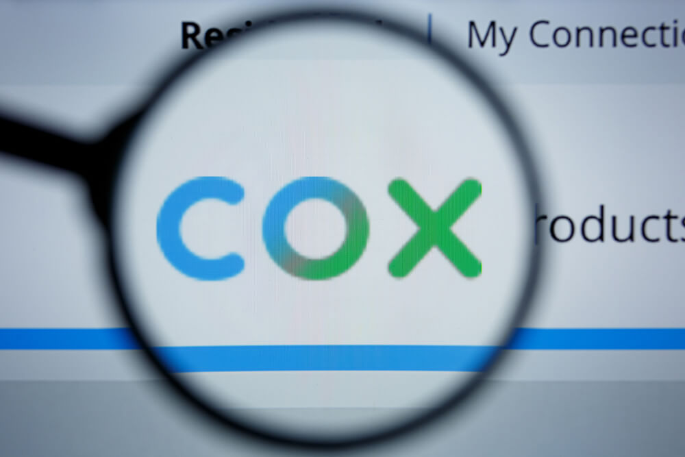 Cox: COX logo visible on display screen.