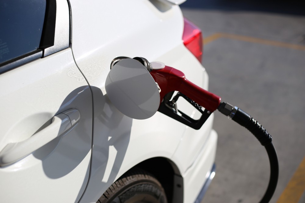 Wibest – Oil and petroleum: A car refueling at a gas station. 