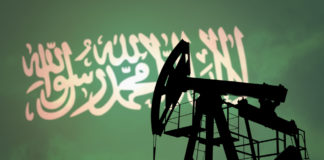 Wibest – United States: Iranian flag over an oil pump jack.