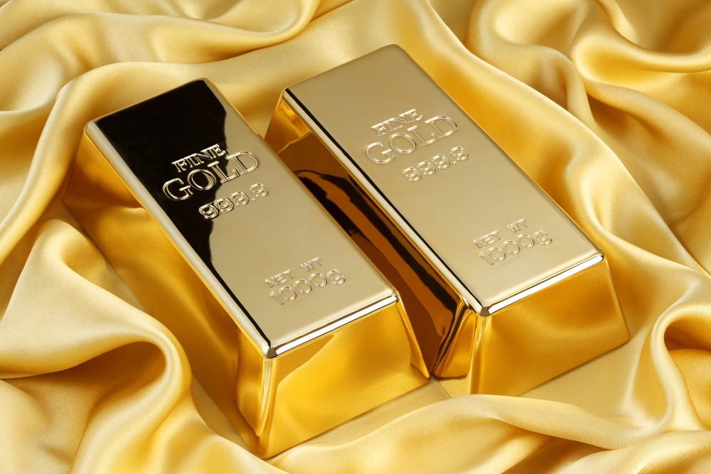 Wibest – Spot Gold Prices: Two gold bars over a gold clothe.