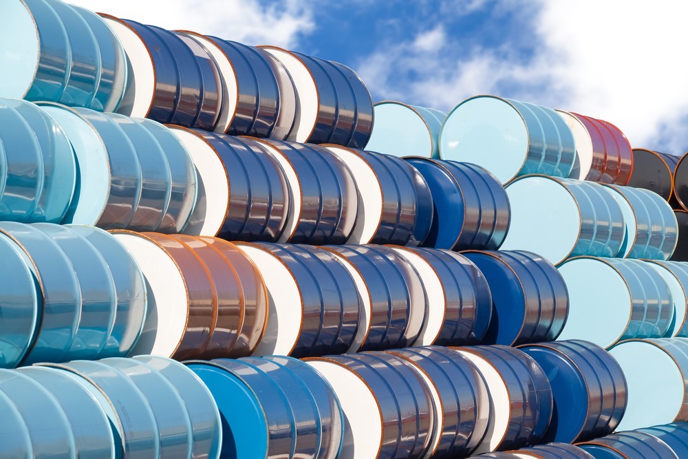 Wibest – Oil Petroleum: Crude oil barrels stacked up.