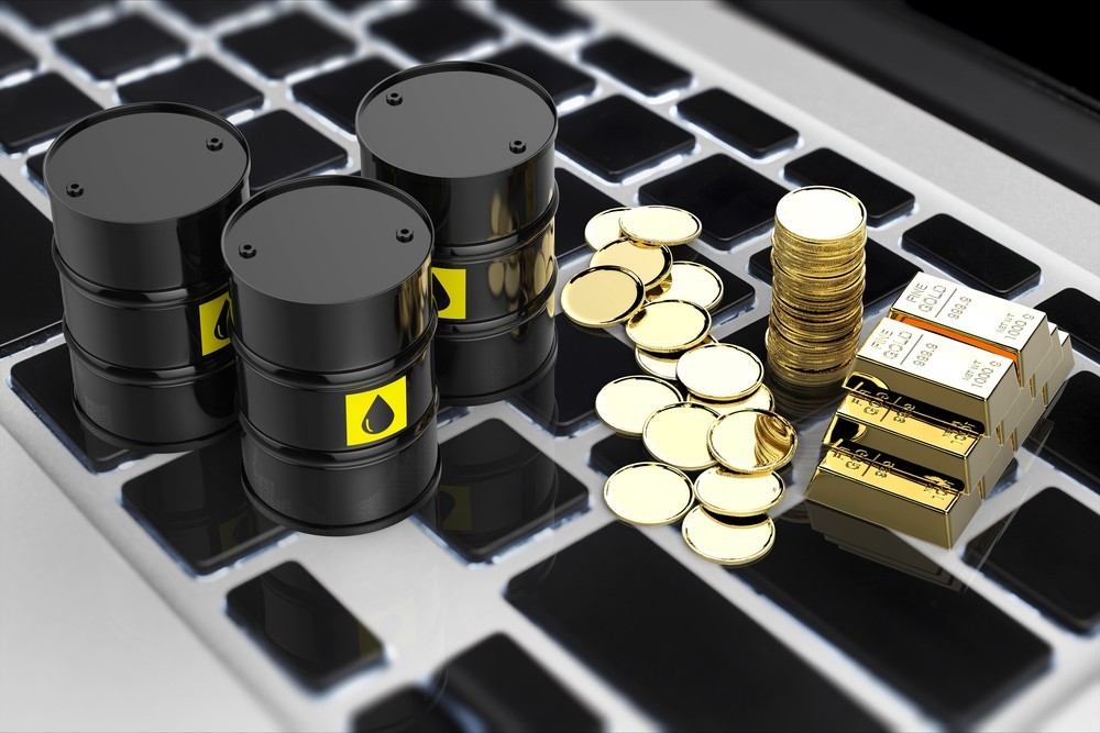 Wibest – Petroleum and oil: Oil barrels, gold bars, and golden coins on top of a keyboard.