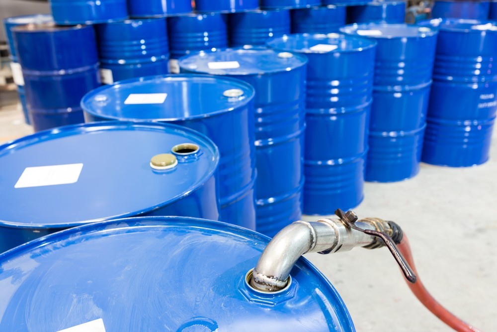 Wibest – Oil Petroleum: Crude oil barrels being refilled in a refinery.