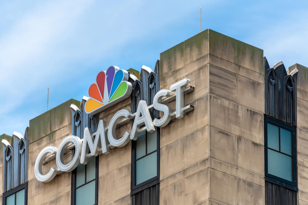 The Comcast Studios logo seen on top of a building.
