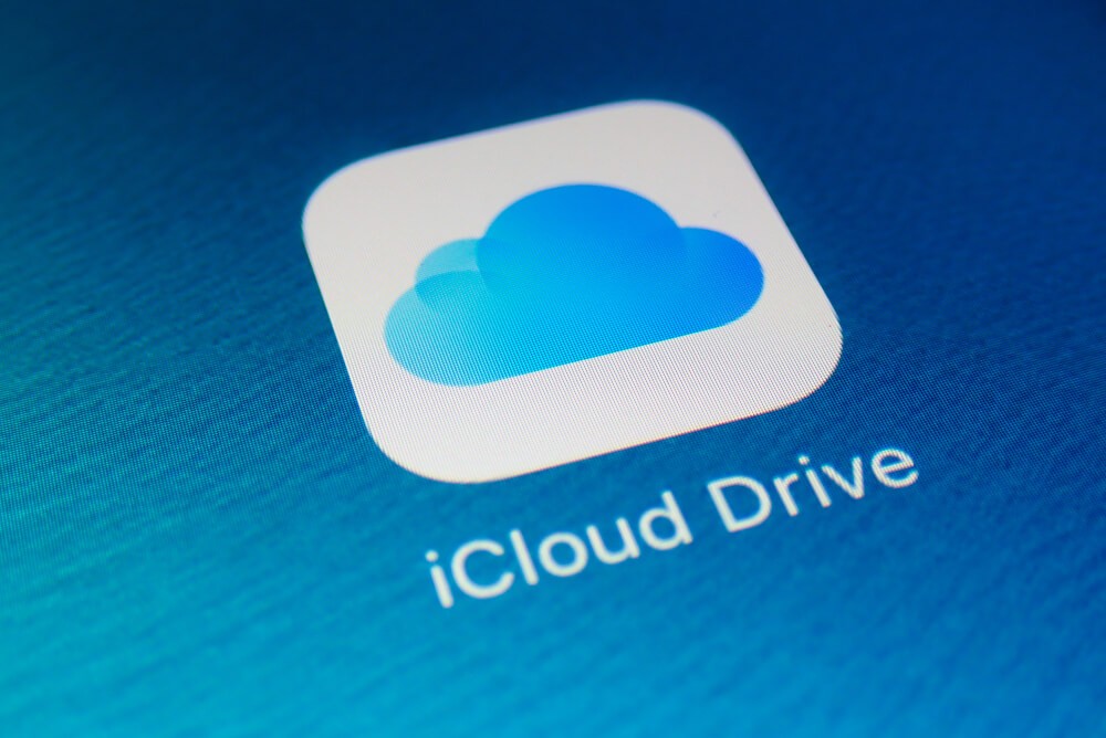A close-up photo of Apple iPhone start screen with iCloud Drive apps icon