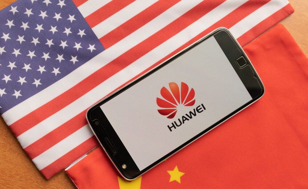 Huawei Logo in Mobile, kept on the US and china flag