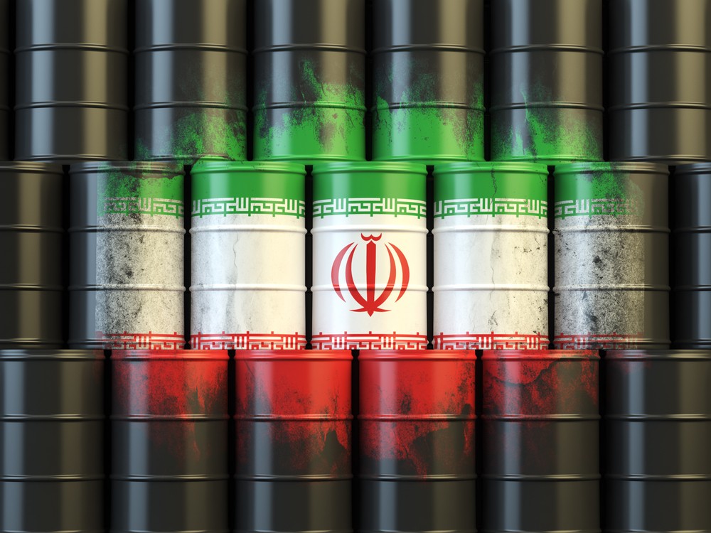 Wibest – Tehran: Crude oil barrels and the Iranian flag.