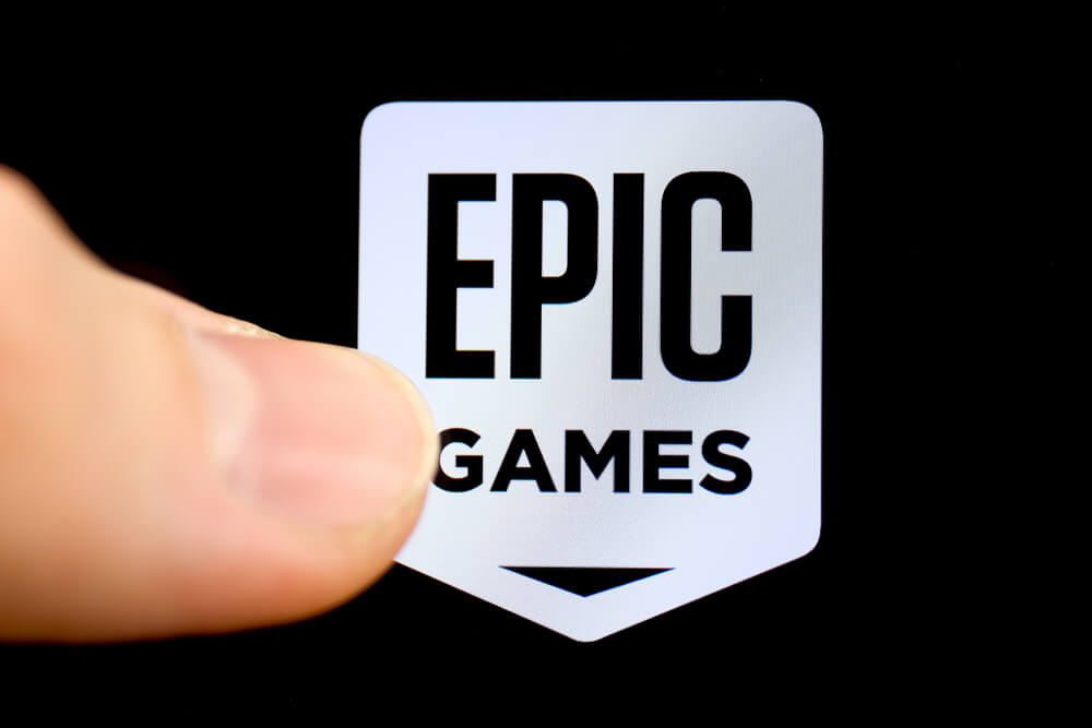 American company Epic Games on the smartphone with finger.