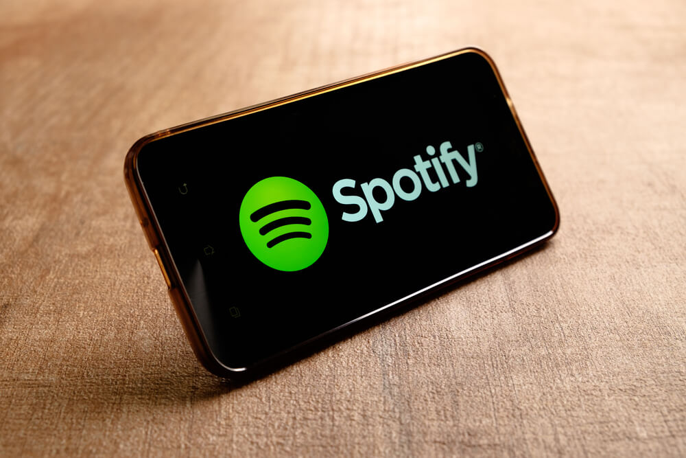 Spotify music service logo in smartphone.