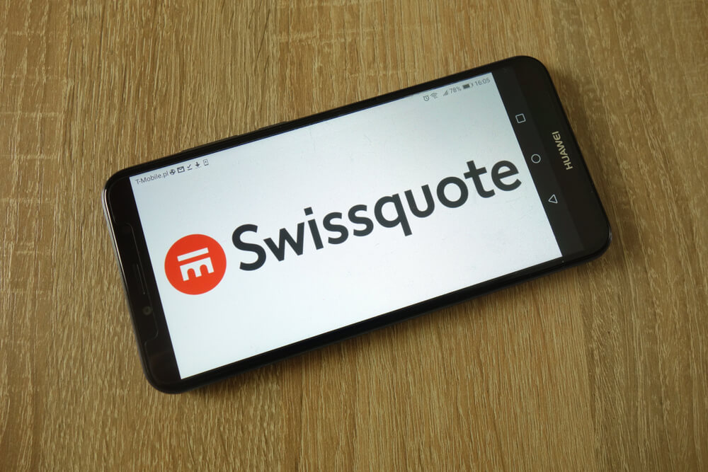 Swissquote Group Holding Ltd logo displayed on smartphone.