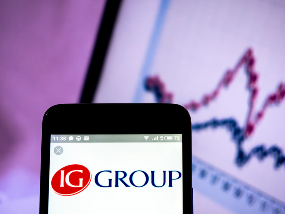IG Group Holings plc logo seen displayed on smart phone.