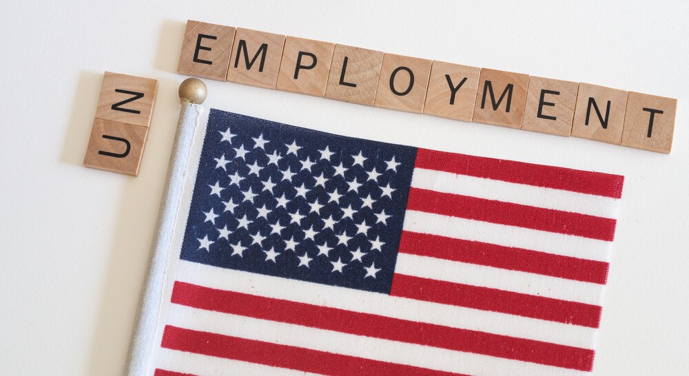 US flag with unemployment word.