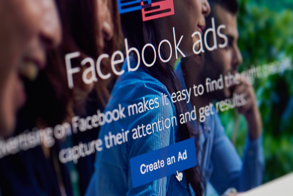 Create an Ad on facebook app on screen close-up