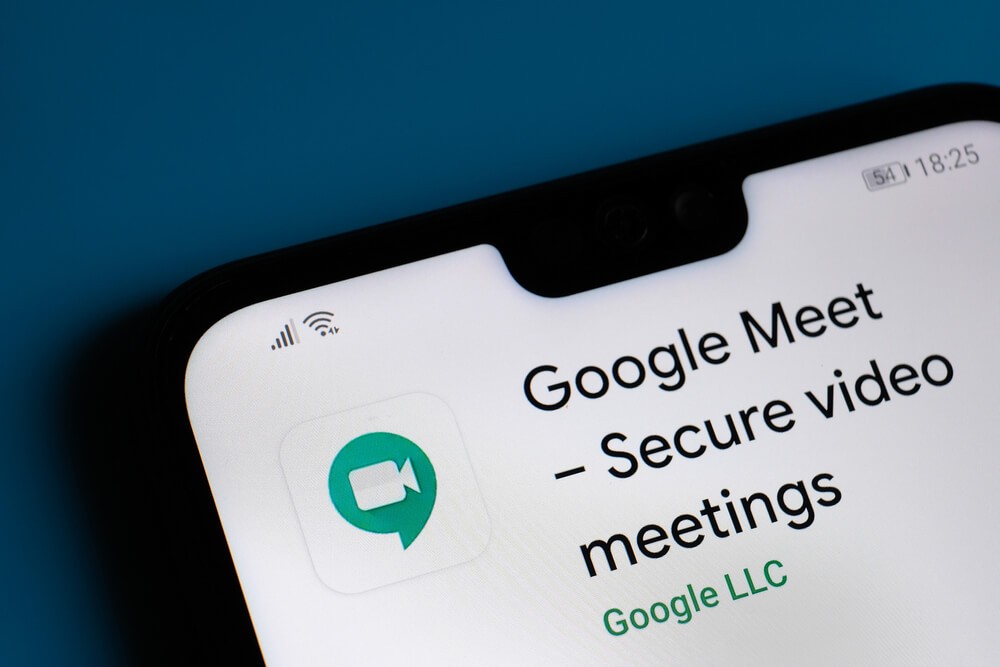 Google Meet app seen on the corner of mobile phone.