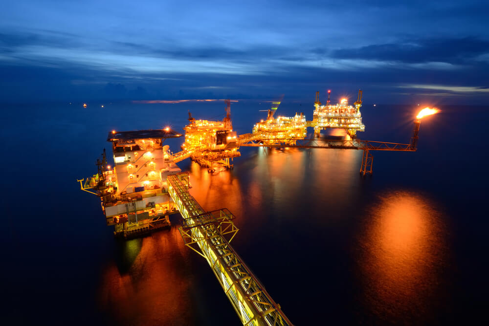 The large oil rig at night.