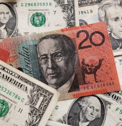 AUD/USD - The Greenback: US dollar and Australian dollar banknotes.