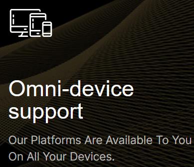 An image featuring the text "Omni-device support" in bold, indicating that the platforms offered are accessible on all types of devices. The text is accompanied by icons representing a desktop computer and a mobile device, suggesting compatibility with multiple device formats. The backdrop appears to be a textured, dark surface that adds a modern and sophisticated aesthetic to the design.