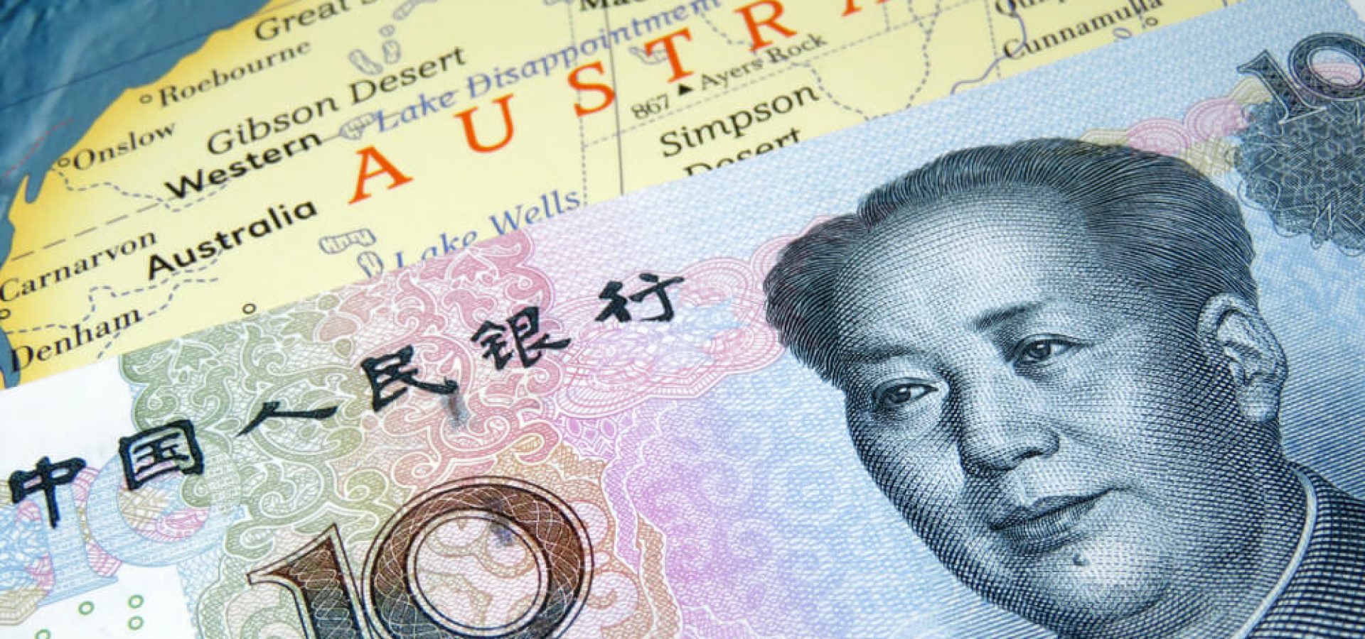 Wibest Broker-Currency Pairs: Yuan banknote on top of Australia map