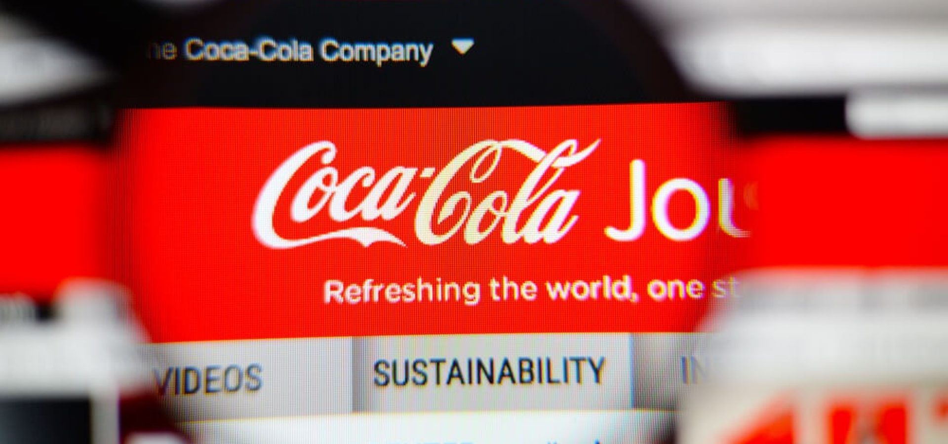 The logo of Coca-Cola stating its sustainability.