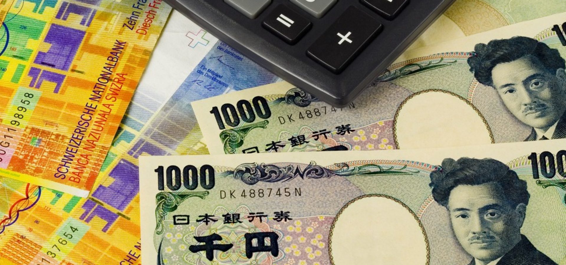 Washington: Japanese yen and Swiss franc bills and a calculator.