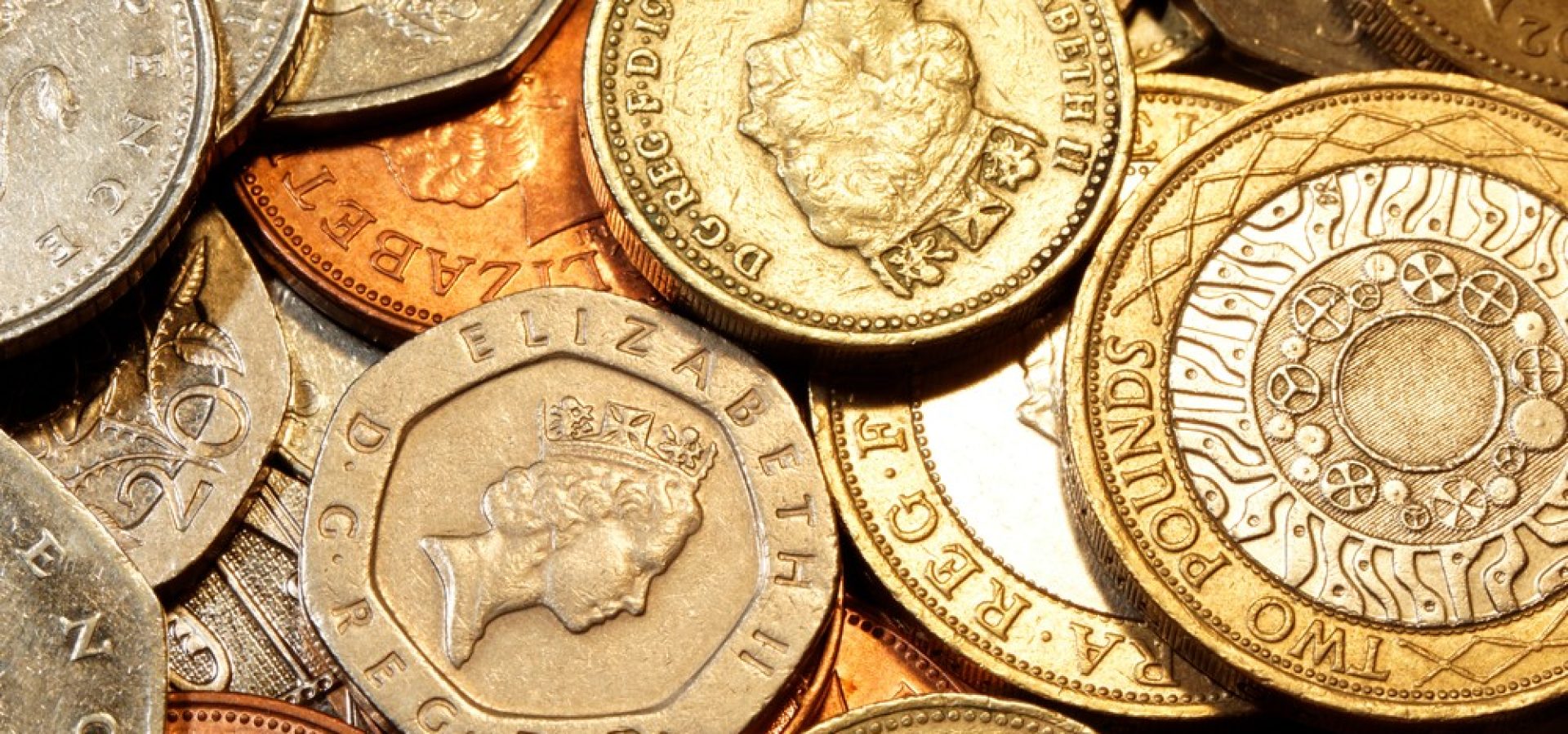 GBP/USD: British pound sterling coins.