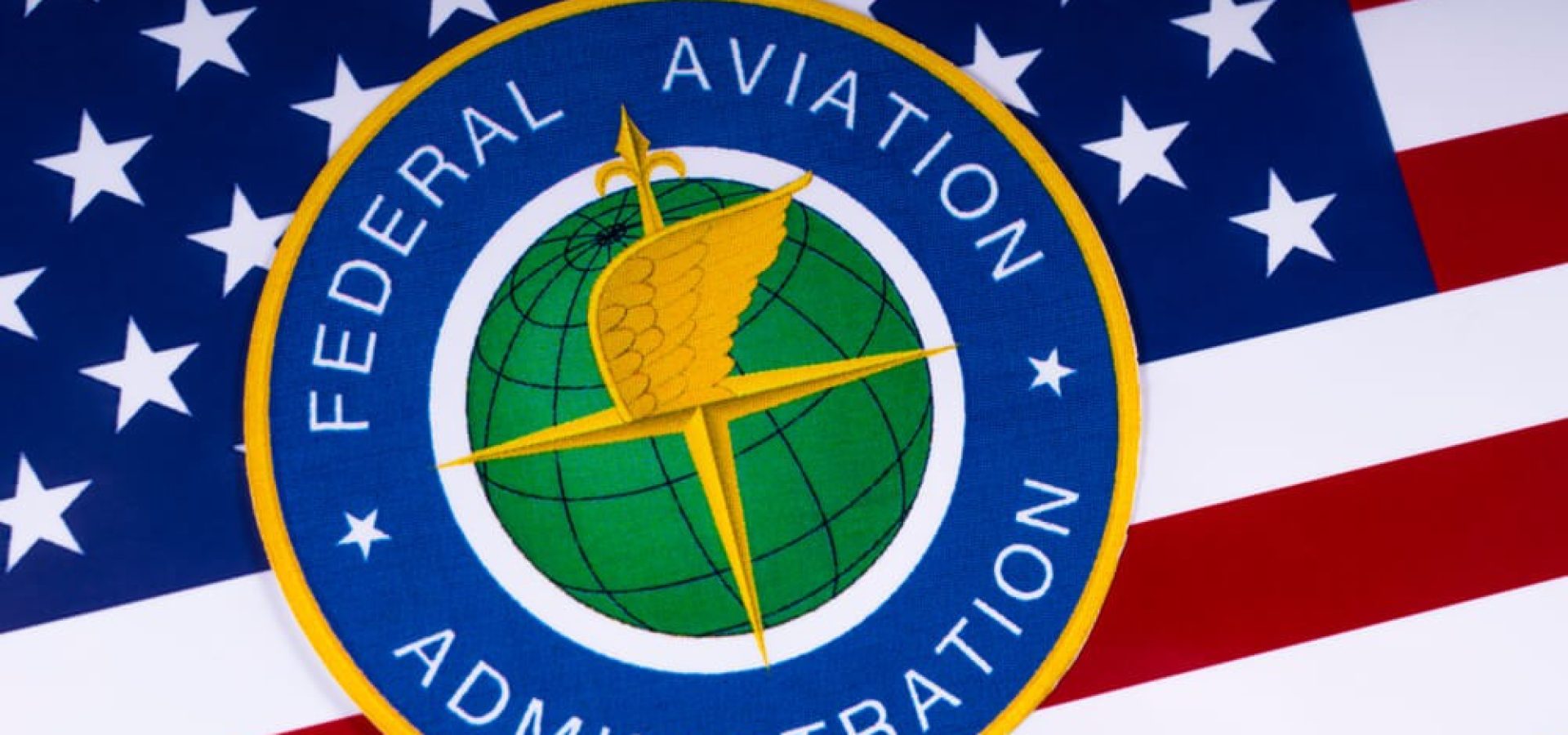 The symbol of the Federal Aviation Administration portrayed with the US flag.