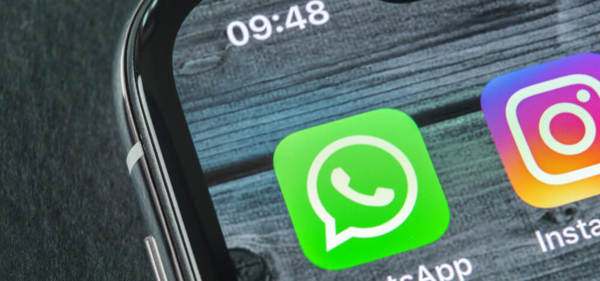 Whatsapp messenger application icon on smartphone.