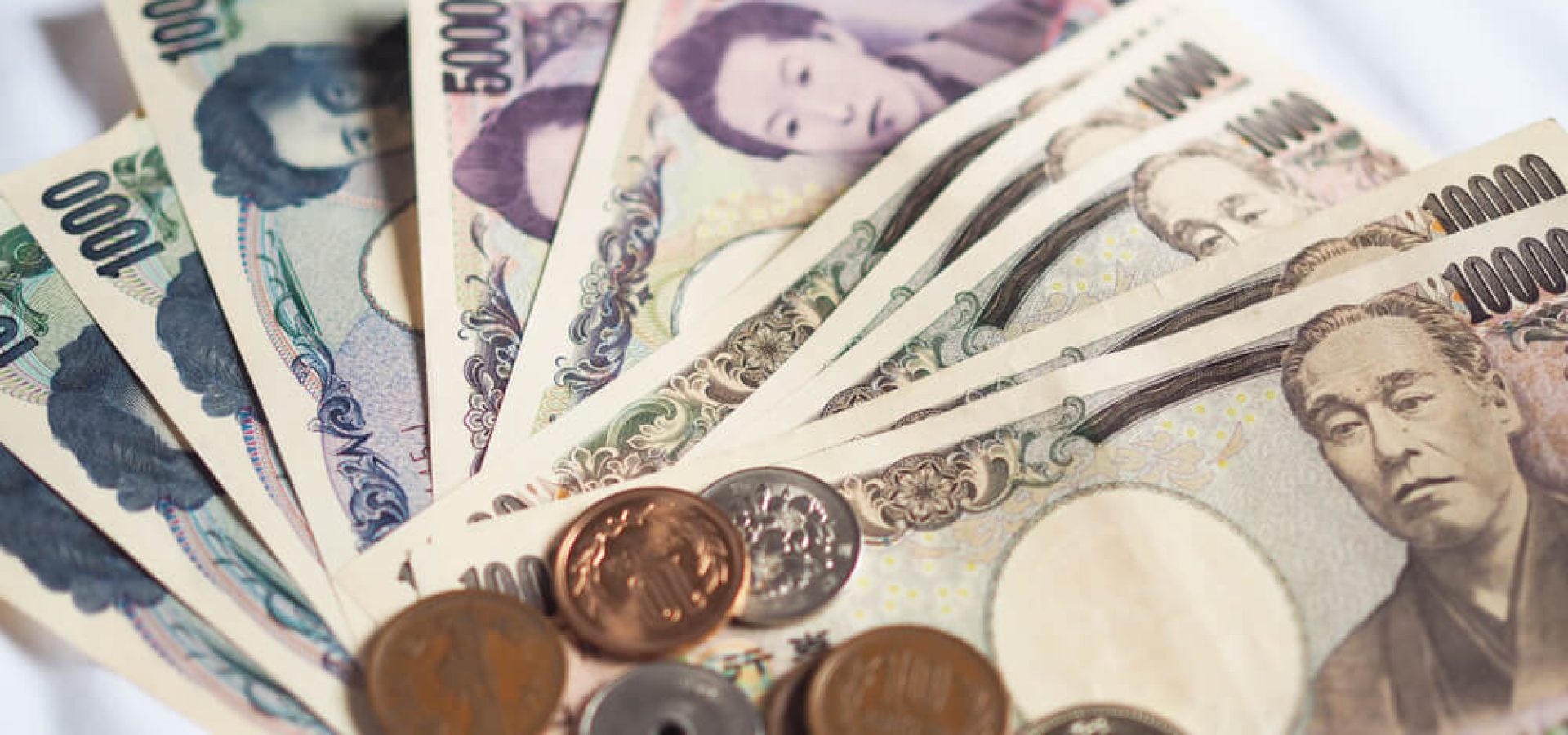 Wibest – Yen Exchange Rate: Japanese yen bills and coins.